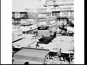 Unloading 3 Leyland double decker London buses, White B...