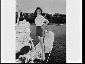 Fashion model wearing terylene on Len Staples' yacht So...