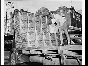Unloading cartons of apples at the Paddy's Markets