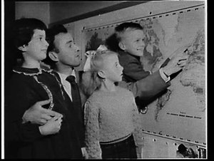Keith Smith and children looking at a map in the 2GB st...