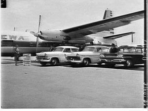 Hughes hire cars and an East-West airlines' Fokker Frie...