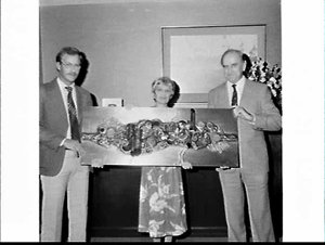 Presentation of card, flowers and metallic wall plaque ...