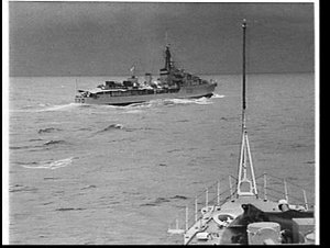 HMAS Arunta from the bows of HMAS Warramunga at sea off...
