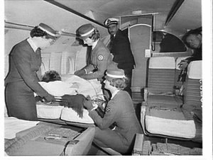 Stretcher fitted over passenger seats on an Airlines of...