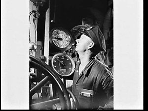 Engineer checking gauges in the engine room of HMAS Anz...