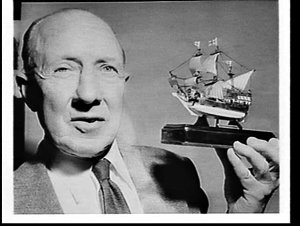 Dave Barnes (?) with a model of the Mayflower (ship)