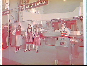 Models on the Alfa-Laval exhibit at a dairy exhibition,...