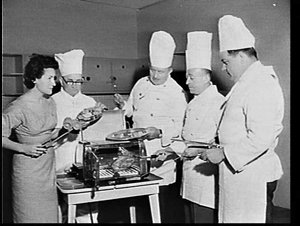 Del Cartwright and chefs barbecuing chicken in a St. Ja...
