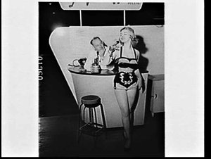 Woman in swimsuit drinking a glass of wine at the Penfo...