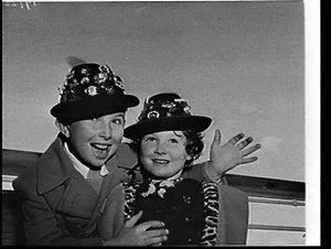 Children with souvenir badges on hats on the Liner Oron...