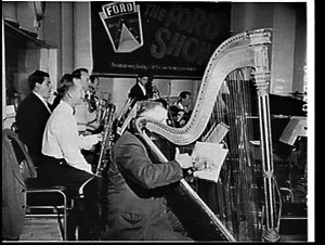 Evan Davies, concert harpist, with the orchestra on the...