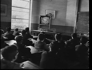 Schoolboys watching a television broadcast at Sydney Bo...
