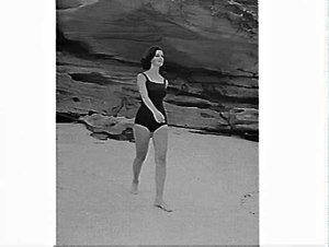 Photographs of a female model in a Jantzen swimsuit tak...