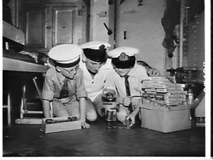 Orphan boys given toys on a visit to HMAS Tobruk
