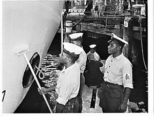 Papuan sailors and petty officer from HMAS Banks painti...