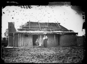 Woman and children with bark house, Hill End
