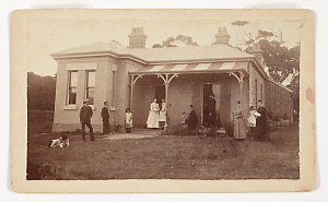 [Photograph of a family posing outside house, Sunny Cor...