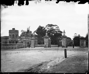 Gatehouse and entrance gates to Government House with s...