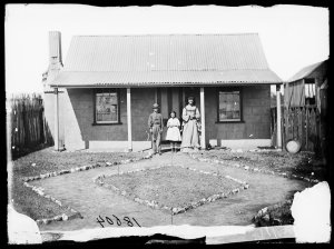 Woman and children with house, Hill End