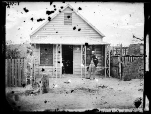 Two men and a weatherboard house, (next to James Barrie...