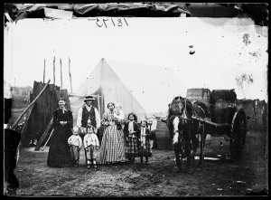 Family, tent & water wagon