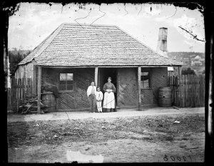 House (next to Fry's store), mother and children, Tamba...