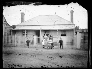 House [of W.T. Pullen] with woman and children, (next t...