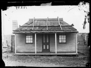 Weatherboard house with bark roof and veranda, Gulgong ...