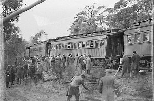 Pressmen riding on tender of small gauge loco on way to...