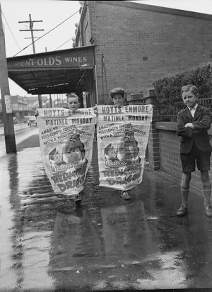Children hold posters advertising Walt Disney's "Reluct...