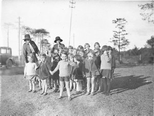 Girl Guides playing games with children, Dalwood Home