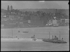 Nobbys, barge being towed
