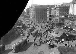 Scene of Circular Quay showing trams, two hansom cabs, ...
