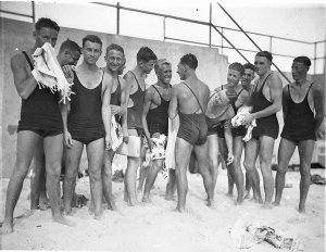 [Young male surfers ("The Pier Club Mob") tease Alf "Ba...