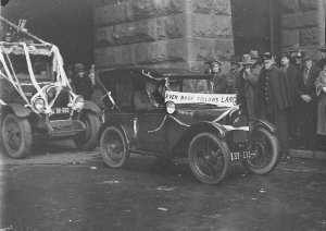 A baby Austin (Austin 7) with poster - "Even Baby follo...