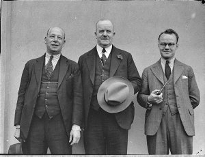 Three men in suits with waistcoats