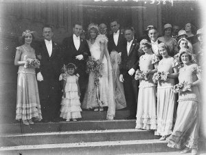 Bridal couple and guests on steps of church