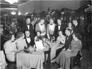 Group of Army officers and civilians at a table