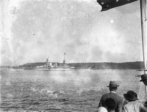 HMS "Renown" proceeding slowly past Bradley's Head, whi...