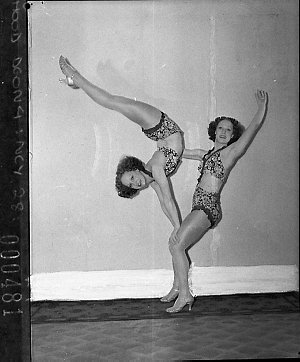 Turner twins, dancers, demonstrate Mignon hosiery