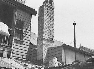 Part of a cottage chimney collapses in wind storm at Re...