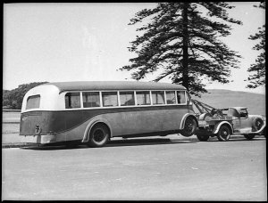 Motor bus being towed to Queensland, 1929 Cadillac towt...