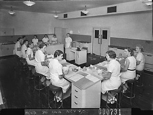 Twelve uniformed women students at a cookery class, Kog...