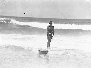 Surfboard riding by Ronnie Anderson on an old style nin...