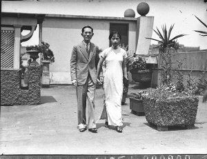 Chinese couple in formal penthouse garden