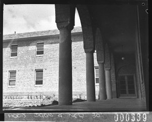 A view of the building through columns and arches, conv...