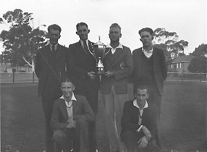 Six cross-country runners; Canterbury team with trophy