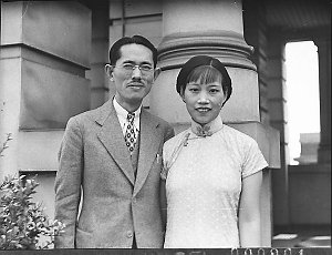 Chinese couple in formal penthouse garden