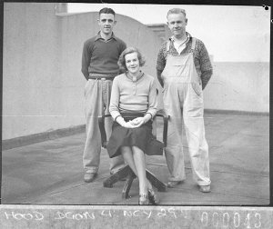 Group of two men and a woman, maintenance staff (?) on ...