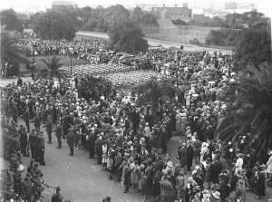 Crowds line the route of march